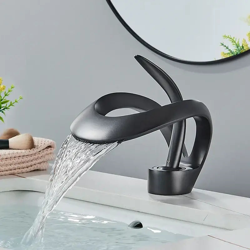 Modern matte black brass waterfall basin faucet with sleek matte finish and contemporary design for bathroom vanity