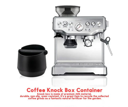 Silver Breville espresso machine with a modern matte black coffee knock box kitchen residue container beside it