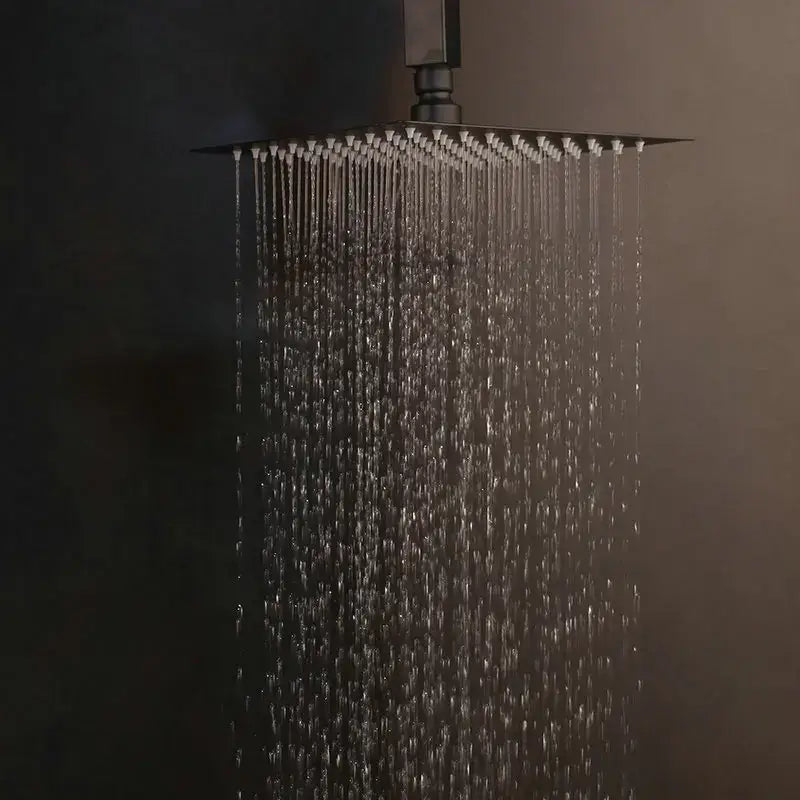 Modern matte black digital shower faucet with black matte-finished square rain showerhead and multiple water streams flowing downward
