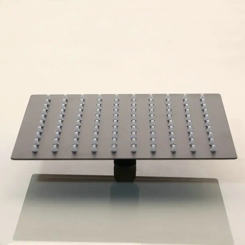 Modern matte black digital shower faucet with rectangular showerhead and evenly spaced rounded nozzles decorbites black digital shower