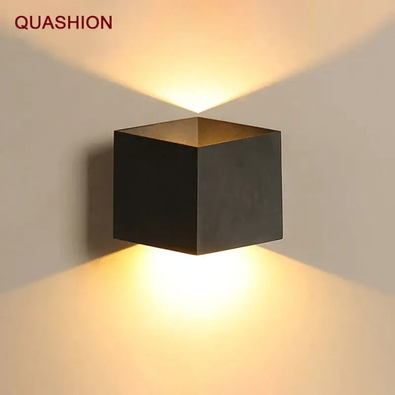 Modern matte black dual-head wall light by quashion with a black matte finish emitting warm directional light decorbites wall lamp