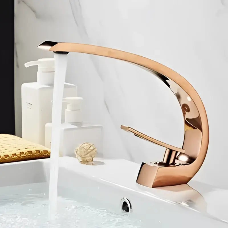 Rose gold modern basin faucet with sleek curved design and polished finish for bathroom use