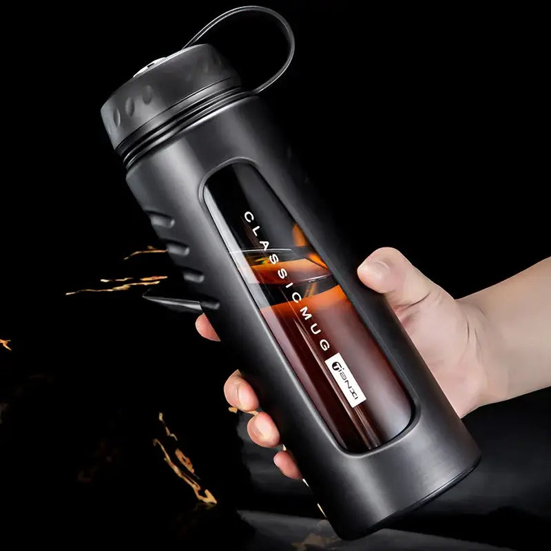 Modern matte black insulated glass water cup with sleek ergonomic design and transparent window showcasing liquid inside