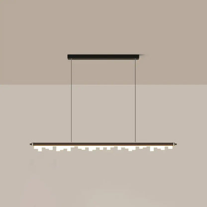 Modern matte black led island light with acrylic shade and chain cord length casting a warm white third glow