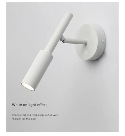 Modern matte black led wall lamp with a minimalist cylindrical design and adjustable arm for wall lamp reading in bedroom
