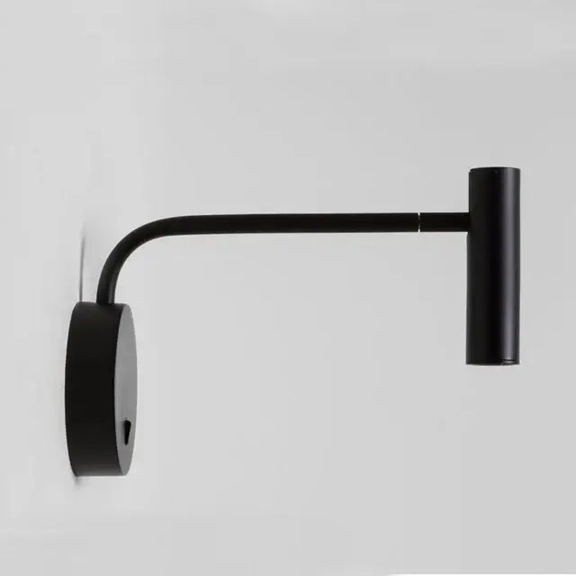Modern matte black led wall light with curved articulated arm and cylindrical head ideal for bedroom reading decorbites gold led