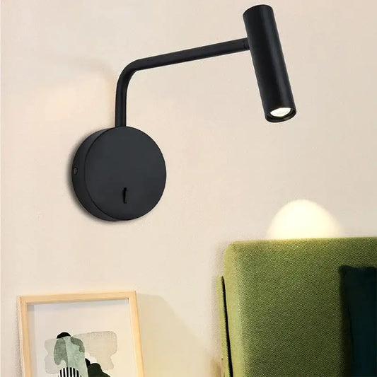 Modern matte black led wall lights with curved arm and cylindrical head for bedroom reading in black matte finish