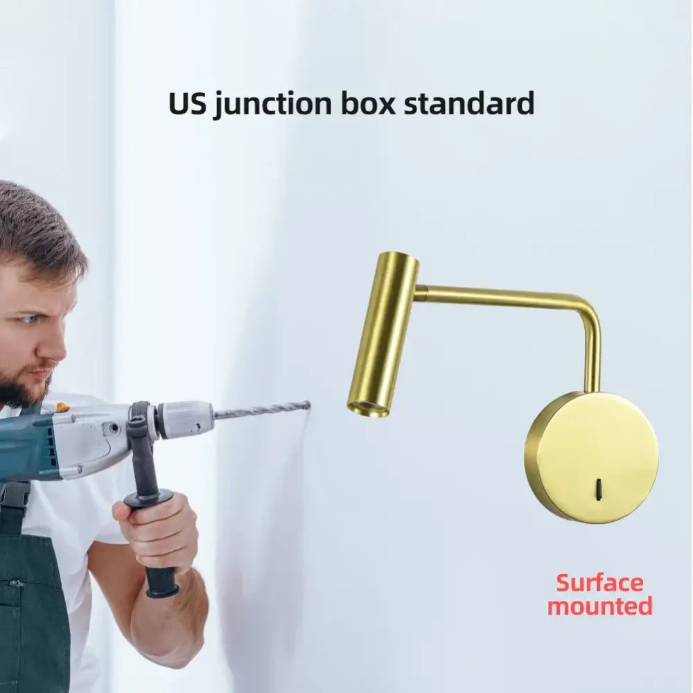 Brass-finished surface-mounted wall lights with sleek curved arm and cylindrical head for modern led wall lighting