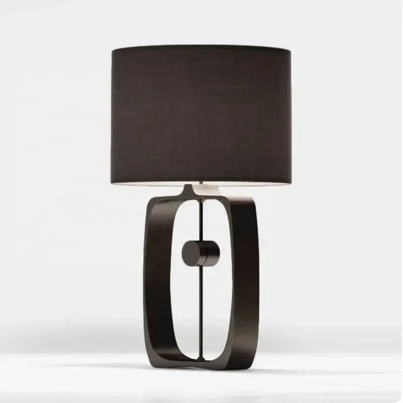 Modern matte black metal table lamp with cylindrical fabric shade for living room decor by decorbites designer