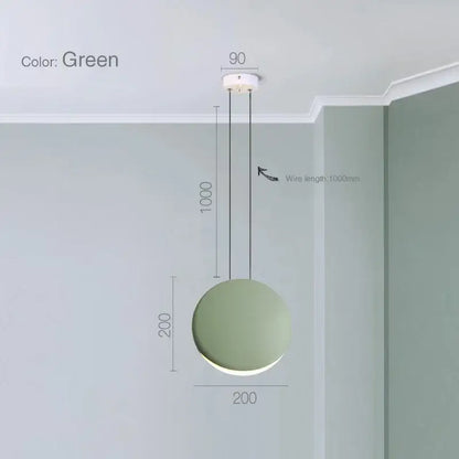 A modern matte black and muted green crescent moon chandelier with a minimalist frosted glass pendant light decorbites crescent moon