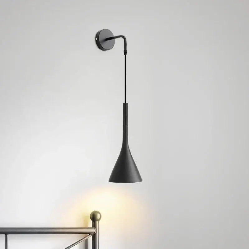 Modern matte black nordic led wall light with a sleek conical shade and curved arm for bedroom reading decorbites black nordic