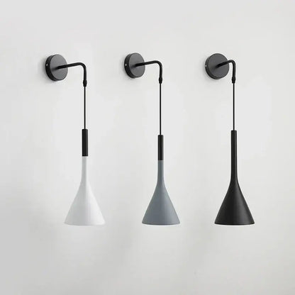 Three minimalist modern matte black nordic led wall light sconces with black bases and conical white gray and matte black shades