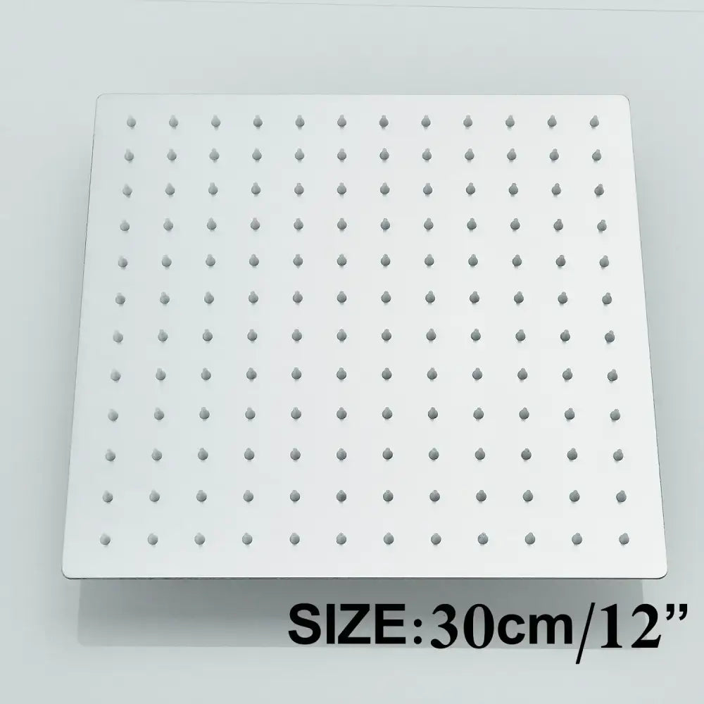 Square white showerhead with rounded nozzles in a modern matte black rainfall shower head set bathroom fixture