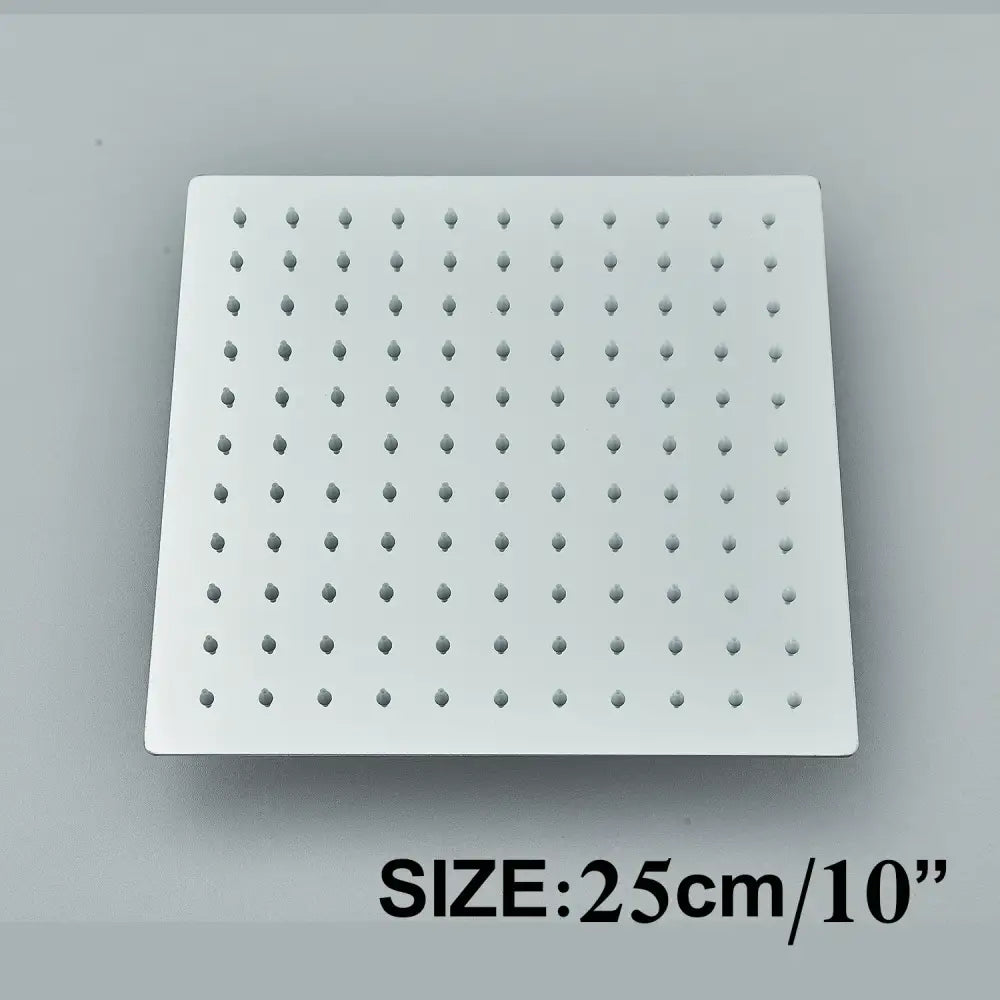 Modern matte black shower head set featuring a square white showerhead with evenly spaced rounded nozzles