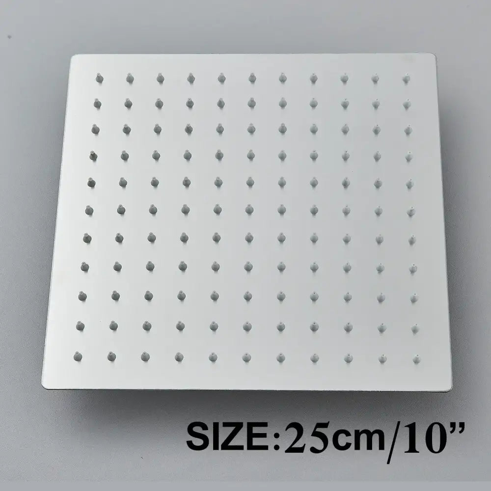 Modern matte black shower head set featuring a white square rainfall shower head with evenly spaced nozzles