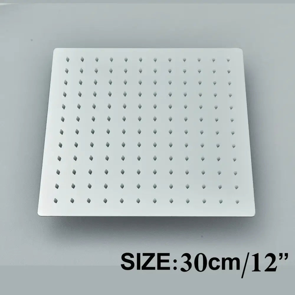 Modern matte black shower head set featuring a white square metal shower head with evenly spaced perforations