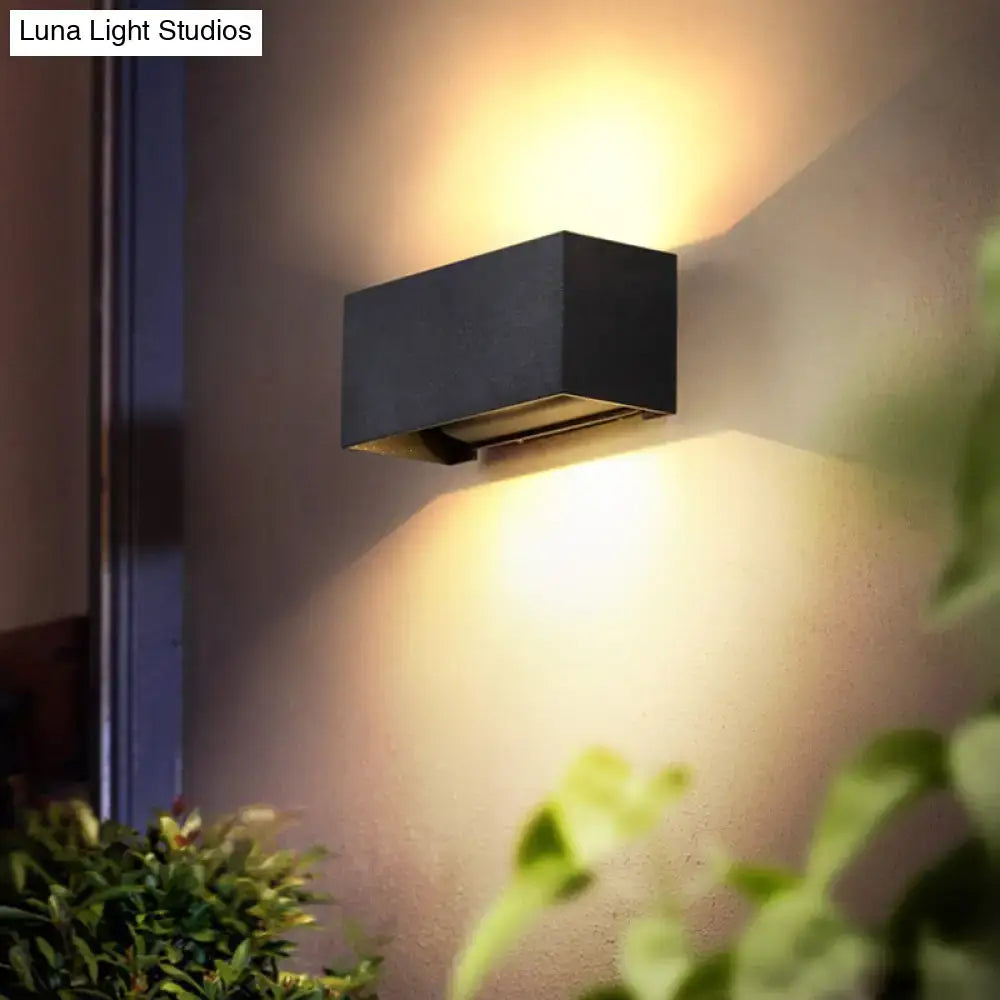 Modern matte black rectangular wall light fixture with sleek design emitting warm ambient light for 220v-240v or 110v-120v use