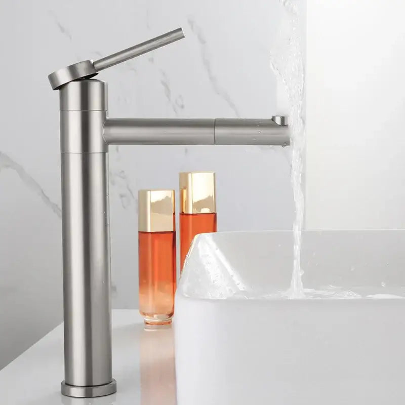 Modern brushed stainless steel rotating basin faucet with sleek tall design and angled spout for bathroom use
