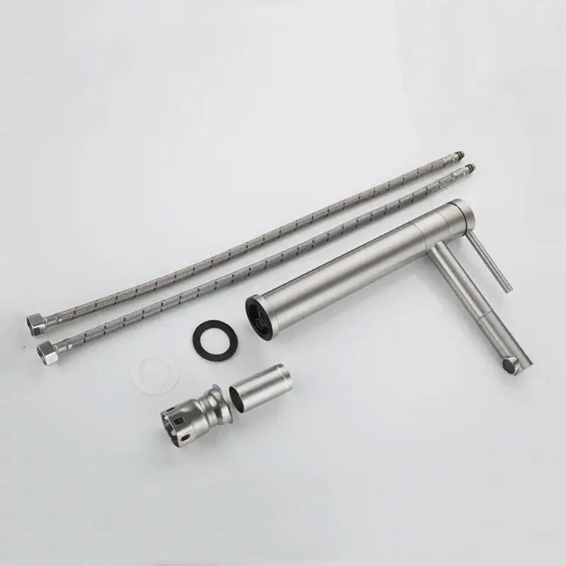 Modern brushed stainless steel rotating basin faucet with single handle and braided metal hoses for kitchen use