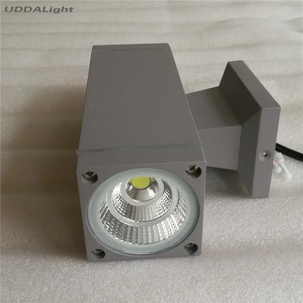 Modern matte black and silver outdoor wall lamp with gray rectangular led spotlight and frosted lens for garden use