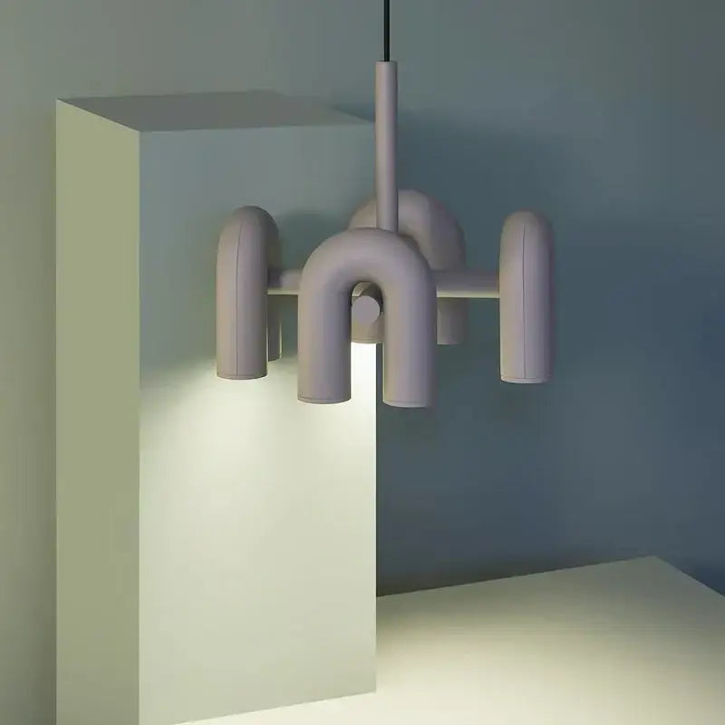 Modern matte black and silver tube wall lamp with pastel lavender ceramic arms in abstract geometric design decorbites cirkus tube
