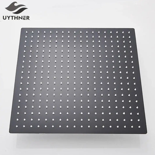 Modern matte black square rainfall shower head with black matte finish and white droplet-shaped nozzles grid