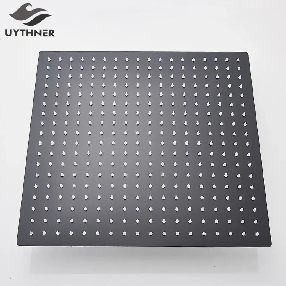 Modern matte black square rainfall shower head with black matte finish and white droplet-shaped nozzles grid