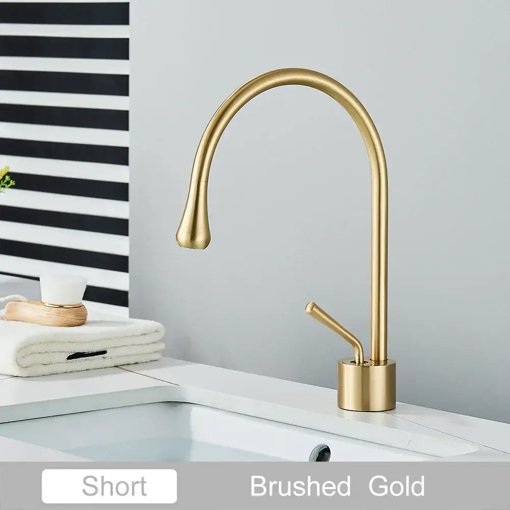 Brushed gold short basin faucet with sleek curved spout and minimalist design ideal for decorbites gold tall basin setups