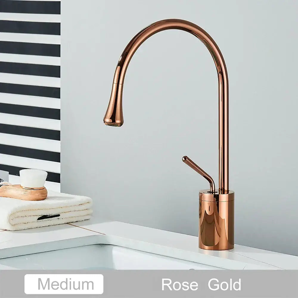 Rose gold basin faucet with a sleek curved spout and cylindrical base ideal for decorbites gold tall or gold tall basin setups