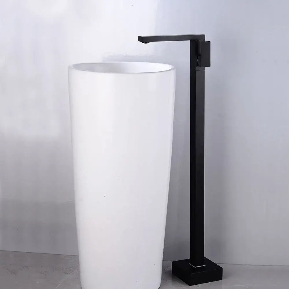 Modern matte black tall basin faucet with sleek minimalist design paired with white cylindrical pedestal sink decorbites black tall basin
