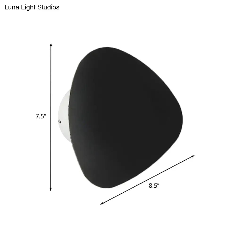Modern matte black triangle wall lamp with a matte finish and white mounting base for corridor lighting