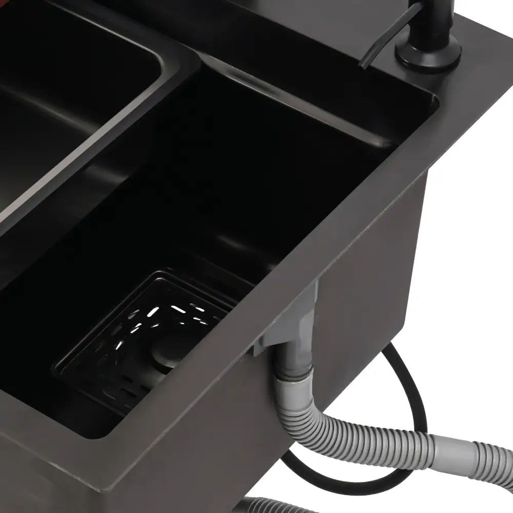 Modern matte black double-basin utility kitchen sink with integrated drain basket and accessories in matte finish