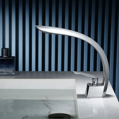 Modern chrome finished waterfall basin faucet single handle mixer with sleek curved design for bathroom use