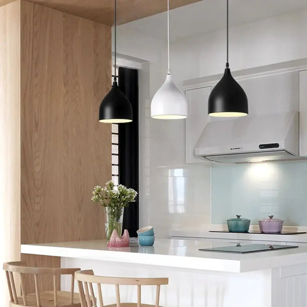 Three modern pendant lights with black and white matte metal shades from decorbites colorful nordic pendant collection for kitchen decor