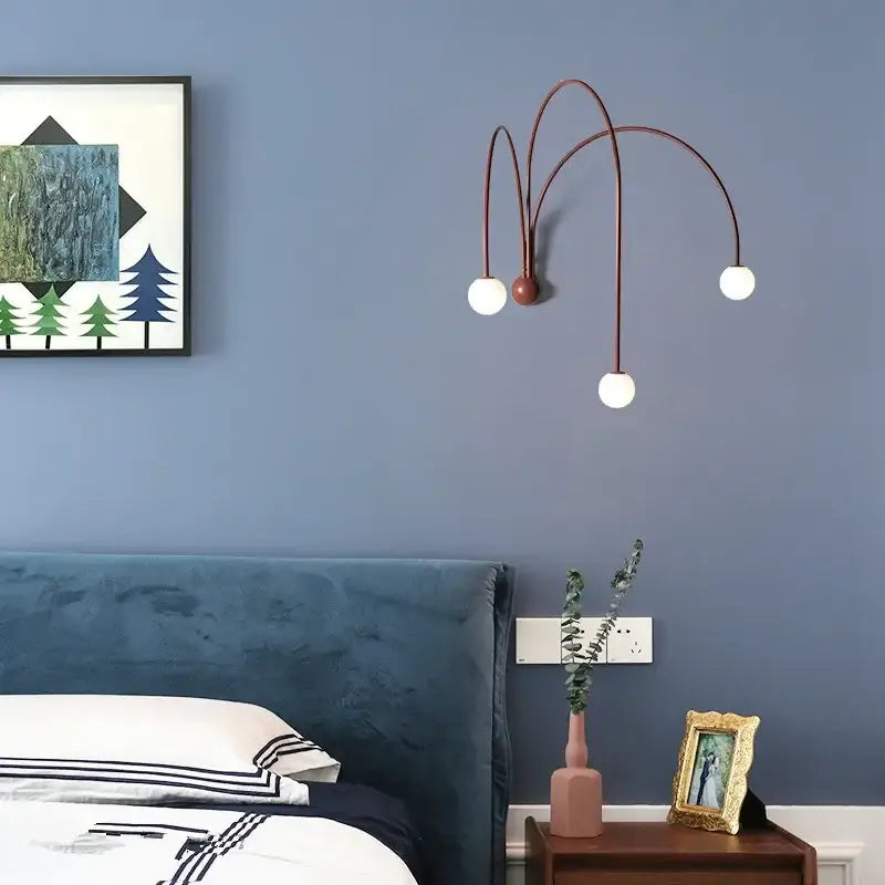 Modern matte copper glass ball wall lamp with three curved arms and white spherical bulbs for living room decorbites glass ball