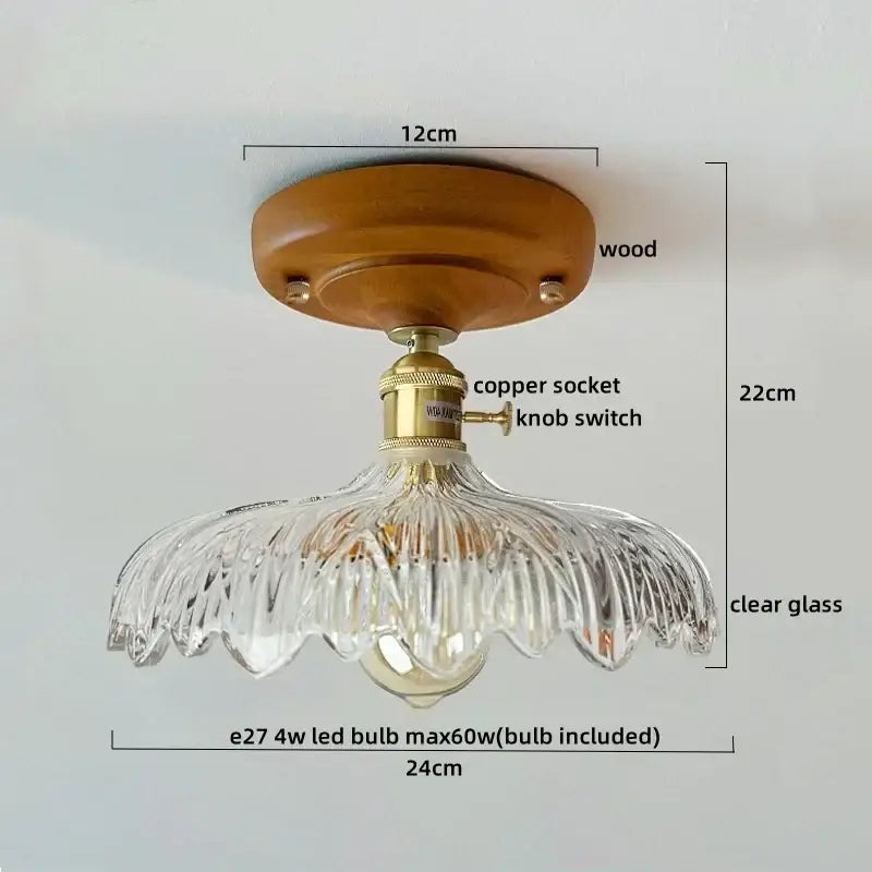 A clear glass ceiling lamp with a wooden base and brass socket featuring a decorbites led wood canopy and fluted design