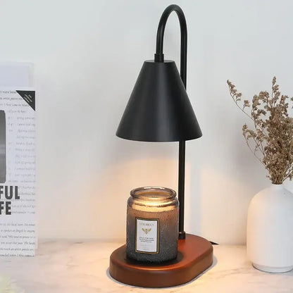 Black metal electric candle lamp warmer with curved arm conical shade wooden base and amber luxurious glass jar