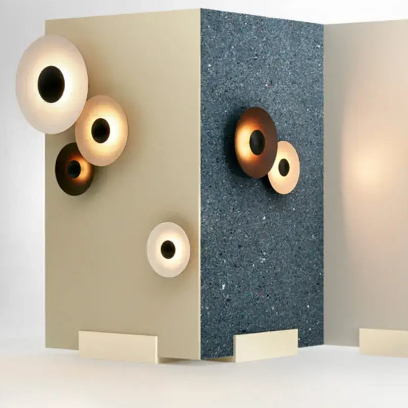 Modern matte white and brushed bronze ginger round wall lamp with minimalist glowing inner rings for bedroom decorbites ginger round wall
