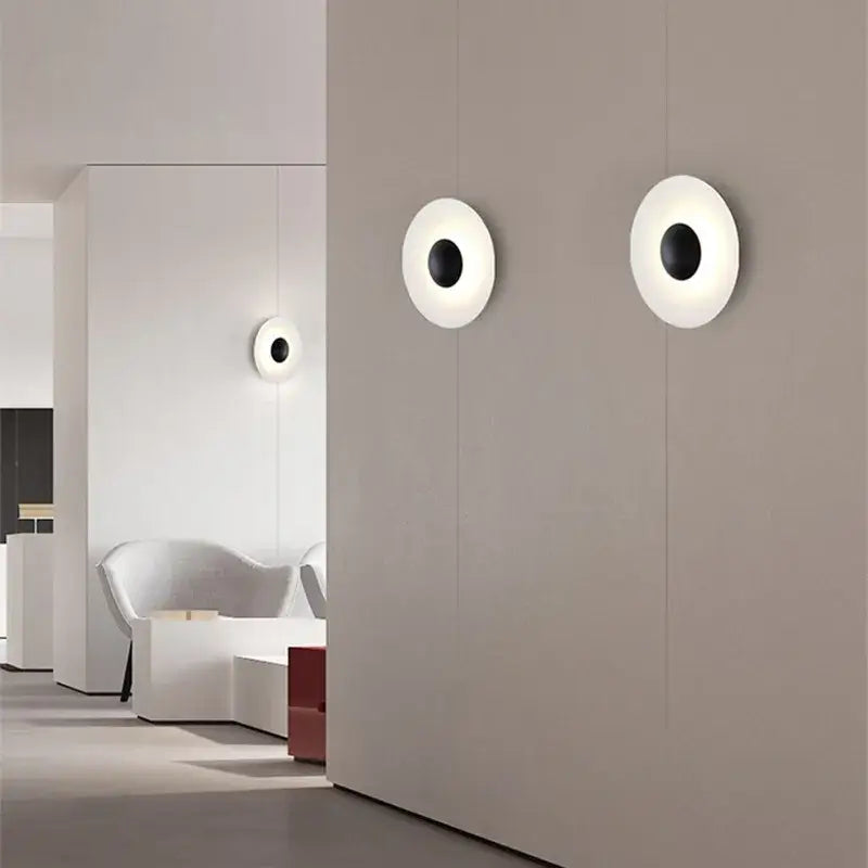 Modern matte white ginger round wall lamp with black center and brushed bronze accents for bedroom decorbites ginger round design