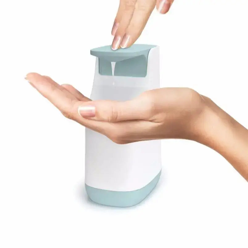 A sleek modern automatic soap pump dispenser with matte white body and teal accents for kitchen space saving