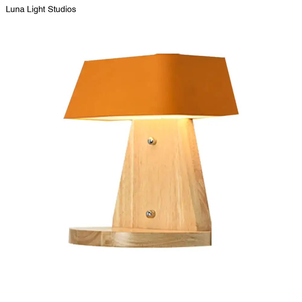 Modern metal light fixture with warm orange fabric shade and wooden backplate featuring visible screws for living room use