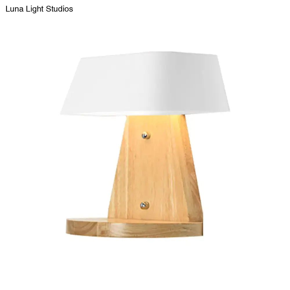 Minimalist wooden table lamp with white fabric shade and brass screws complementing modern metal light fixture wooden backplate