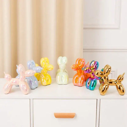 A collection of modern metallic decorbites ceramic balloon dog statues in pastel and iridescent colors for living room decor