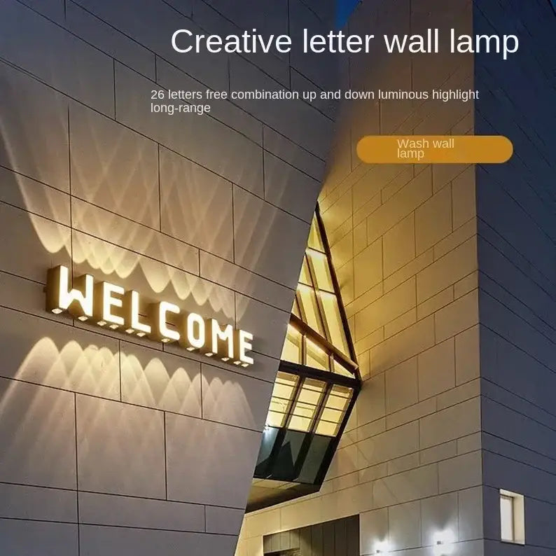 The modern metallic led letter wall lamp features warm glowing lights and customizable digital wall light lettering
