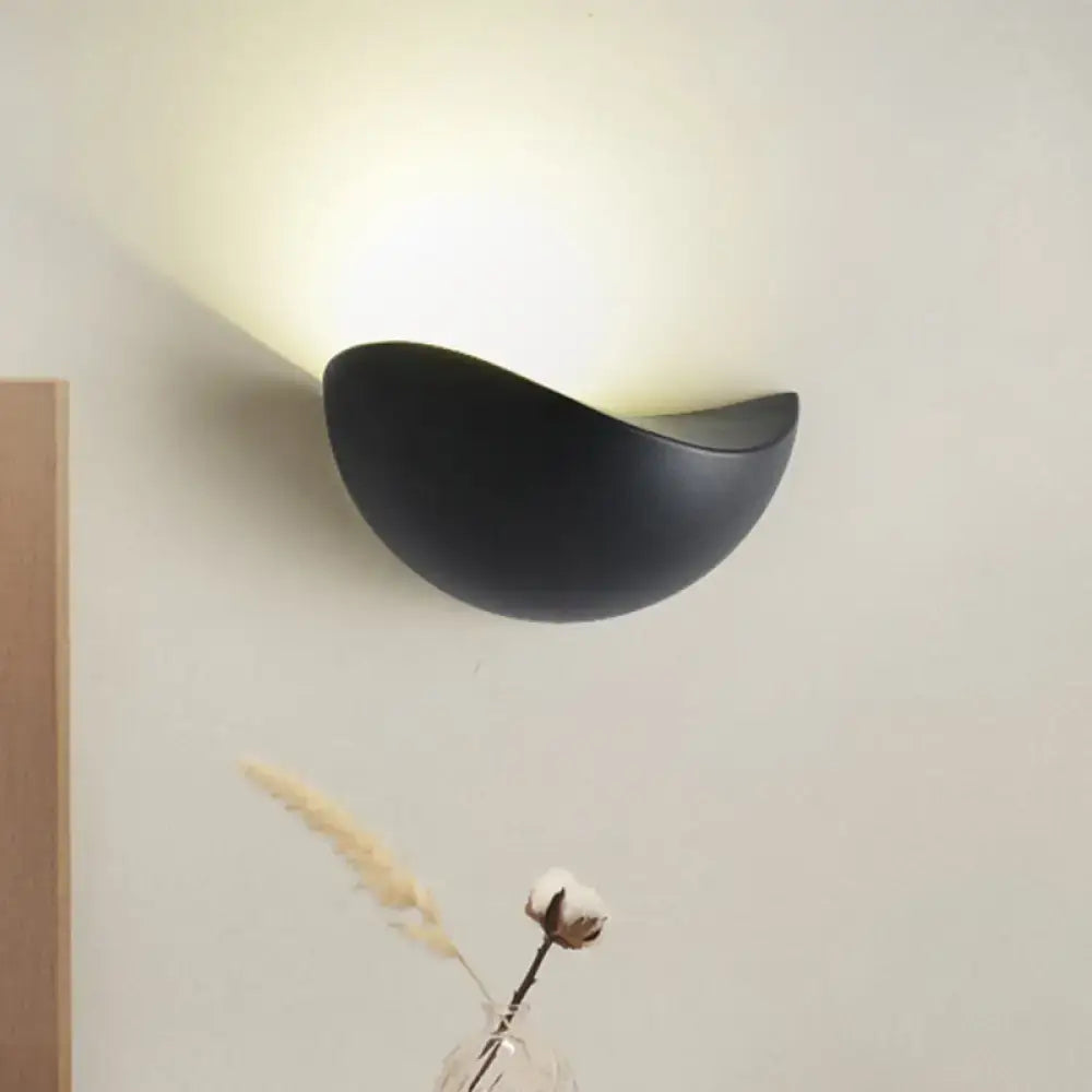 Black matte metallic wall washer light with smooth curved crescent ceramic sconce for modern bedroom decor