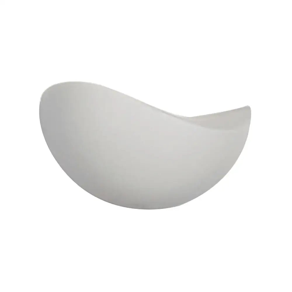 A sleek white ceramic bowl with a glossy finish featured in a modern metallic wall washer light black and white sconce