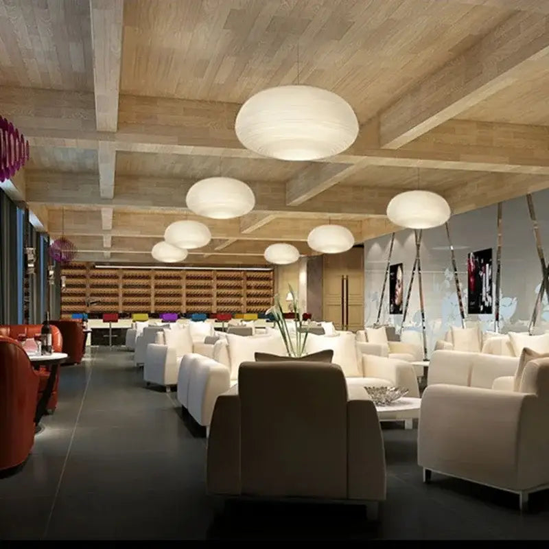 Modern milky white glass whorls cocoon pendant light with spherical diffused glow hanging in dining room
