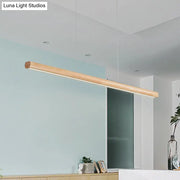 A sleek woodwork island pendant light with smooth finish and integrated led strip for modern minimalism decor