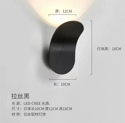 Black brushed aluminum wall light with sleek curved design modern minimalist decorbites adjustable cob led bedroom sconce