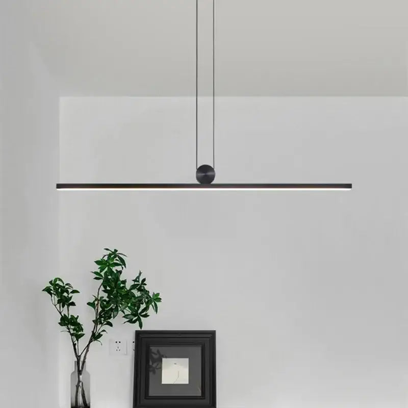 Modern minimalist black dimmable led ceiling chandelier with a sleek linear design and spherical pendant for dining room decorbites dimmable led